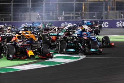 Lewis Hamilton (GBR) Mercedes AMG F1 W12 and Max Verstappen (NLD) Red Bull Racing RB16B battle for the lead at the first race restart.