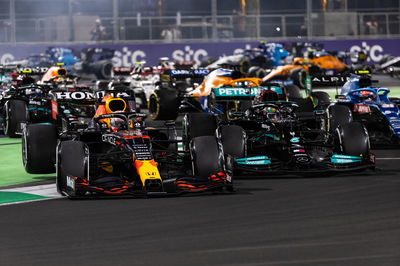 Lewis Hamilton (GBR) Mercedes AMG F1 W12 and Max Verstappen (NLD) Red Bull Racing RB16B battle for the lead at the first race restart.