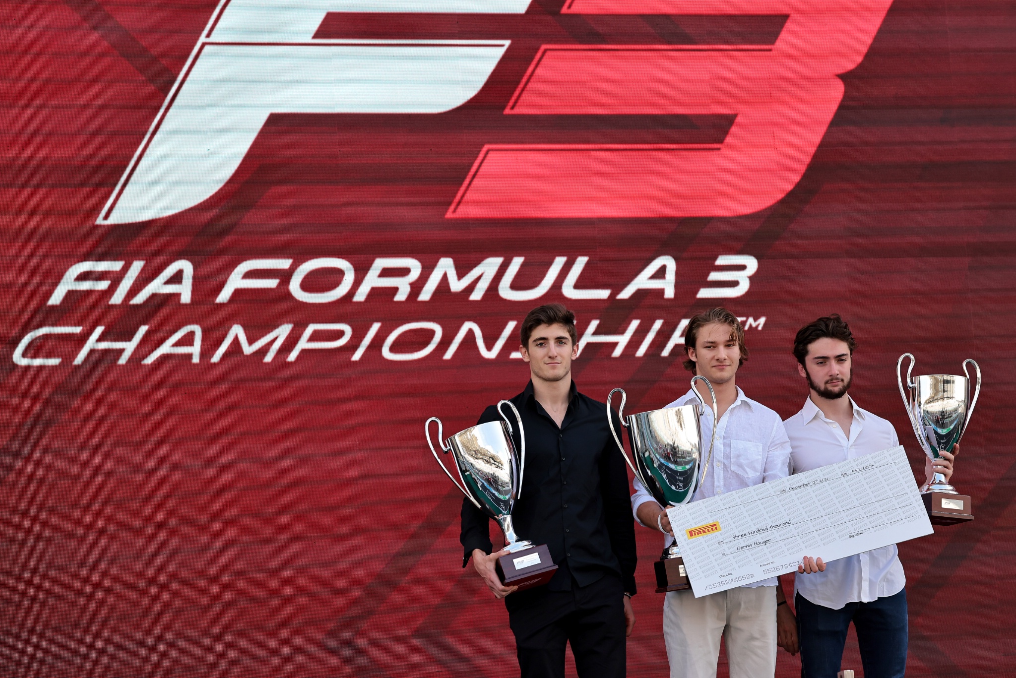 Tiga teratas di kejuaraan F3 (kiri ke kanan) : Jack Doohan (AUS) Trisula, kedua; Dennis Hauger (DEN) PREMA Racing, juara; Clement Novalak (FRA) Trisula, ketiga.