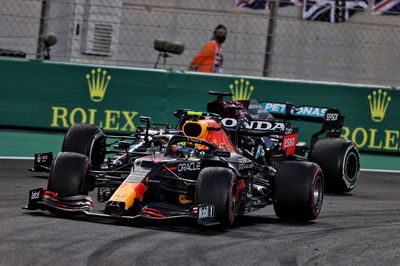 Sergio Perez (MEX) Red Bull Racing RB16B leads Lewis Hamilton (GBR) Mercedes AMG F1 W12.