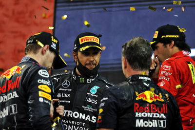 The podium (L to R): Max Verstappen (NLD) Red Bull Racing, race winner, and World Champion; Lewis Hamilton (GBR) Mercedes AMG F1, second; Christian Horner (GBR) Red Bull Racing Team Principal; Carlos Sainz Jr (ESP) Ferrari, third.