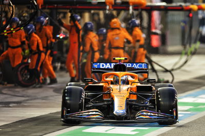 Lando Norris (GBR) McLaren MCL35M makes a pit stop.