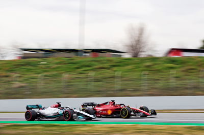 George Russell (GBR) Mercedes AMG F1 W13 and Charles Leclerc (MON) Ferrari F1-75.