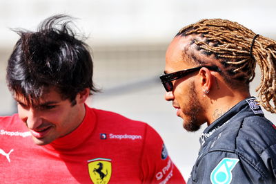 Lewis Hamilton (GBR) Mercedes AMG F1 with Carlos Sainz Jr (ESP) Ferrari.