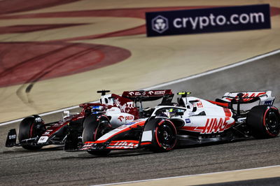 Mick Schumacher (GER) Haas VF-22 and Valtteri Bottas (FIN) Alfa Romeo F1 Team C42 battle for position.