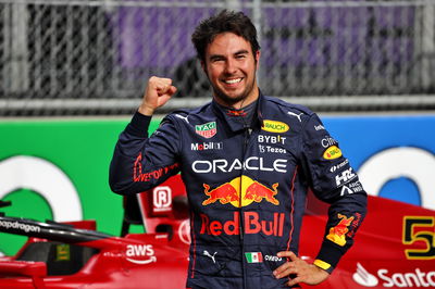 Sergio Perez (MEX) Red Bull Racing celebrates his pole position in qualifying parc ferme.