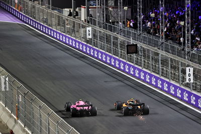 Esteban Ocon (FRA) Alpine F1 Team A522 and Lando Norris (GBR) McLaren MCL36 battle for position.