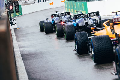 Nicholas Latifi (CDN) Williams Racing FW43B and George Russell (GBR) Williams Racing FW43B at the pit lane exit.