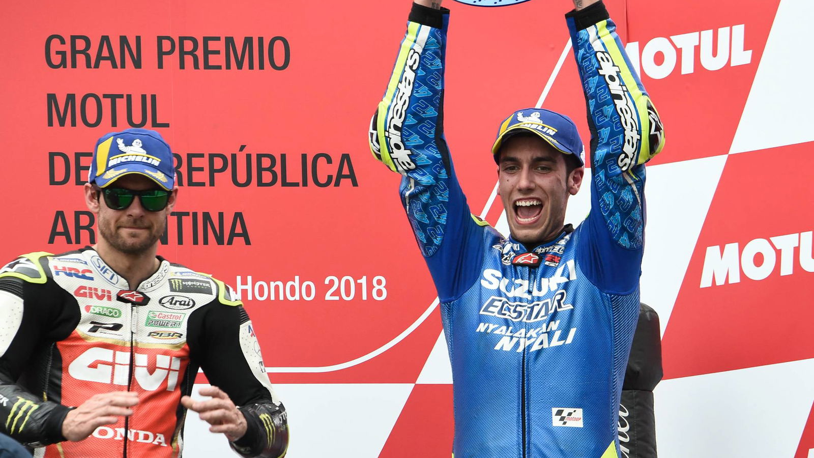 Rins yang berada di depan menuju panggung podium MotoGP pertama