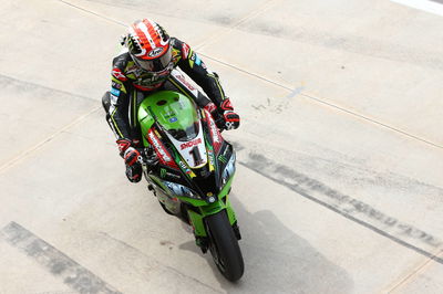 Rea heads damp warm-up as Honda show pace