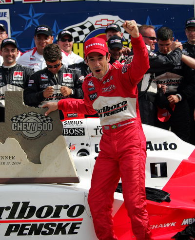 Castroneves climbs fence at Richmond.