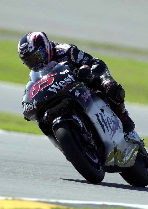 Biaggi wins as rain stops play at Assen.
