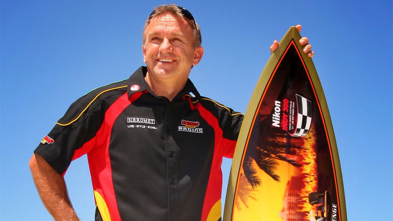 Ingall chasing Indy surfboard.