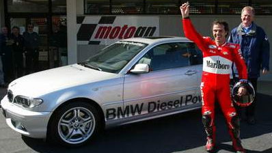 Capirossi wins BMW - gives to Mechanics.