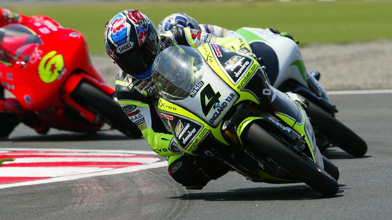 Cecchinello wins bar-banging 125 race.