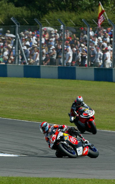 Biaggi takes win after Rossi penalised.