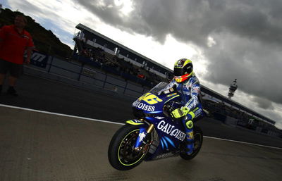 Rain hands Rossi pole.