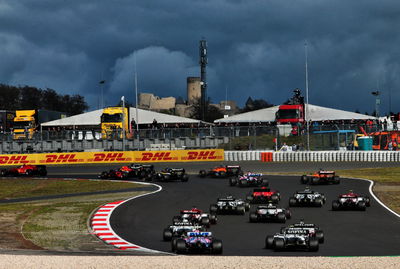 Nico Hulkenberg (GER) Racing Point F1 Team RP20 and Nicholas Latifi (CDN) Williams Racing FW43 at the start of the