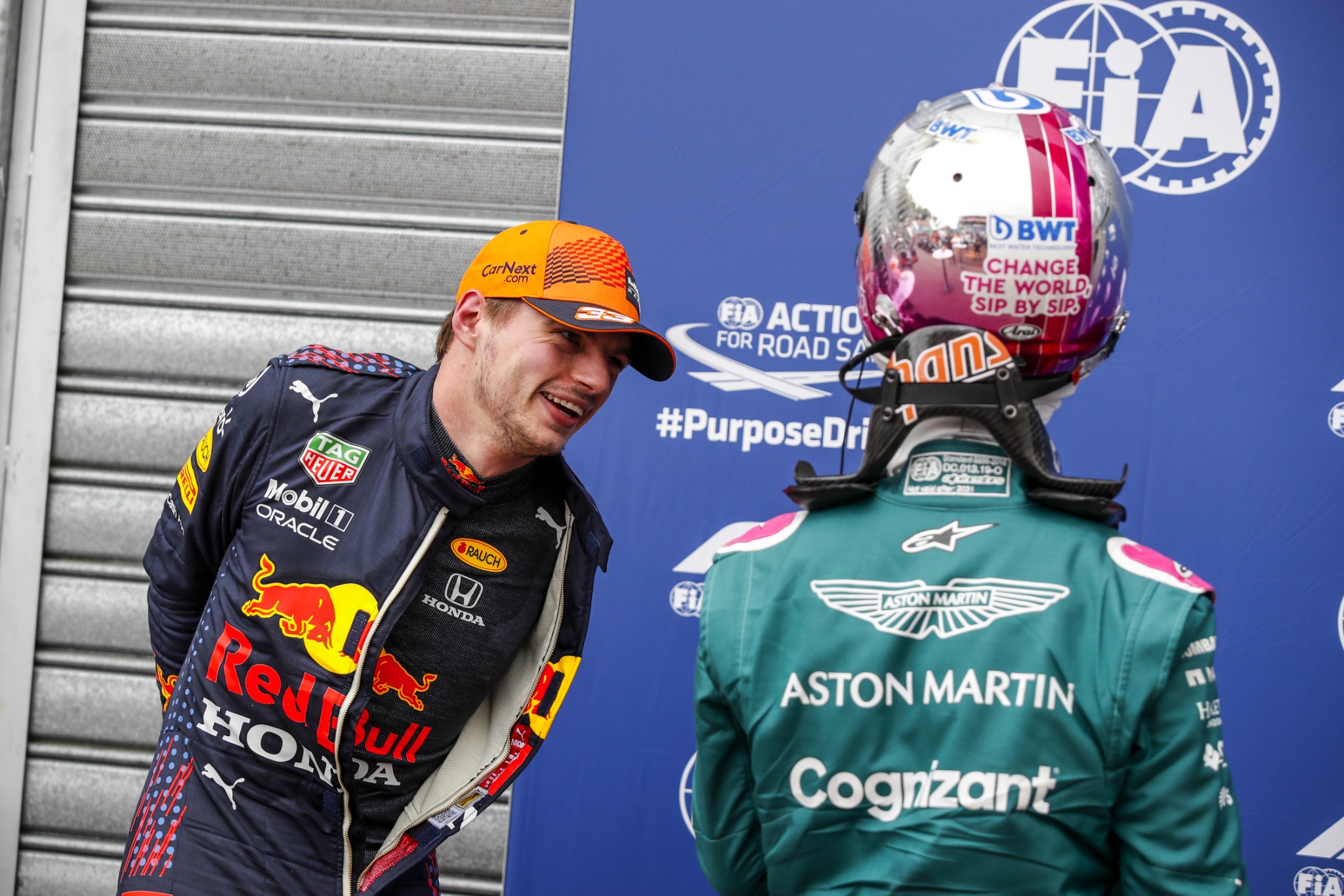Max Verstappen (NLD) Red Bull Racing in qualifying parc ferme with Sebastian Vettel (GER) Aston Martin F1