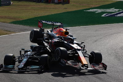 Max Verstappen (NLD) Red Bull Racing RB16B and Lewis Hamilton (GBR) Mercedes AMG F1 W12 crash at the first