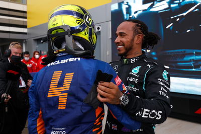 (L to R): Lando Norris (GBR) McLaren with race winner Lewis Hamilton (GBR) Mercedes AMG F1 in parc