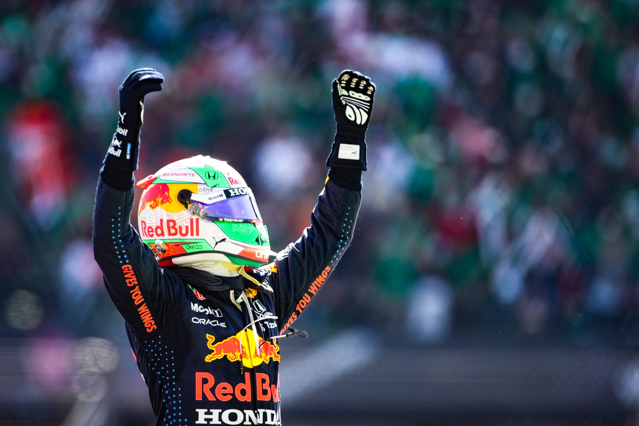 Sergio Perez (MEX) Red Bull Racing celebrates his third position in parc
