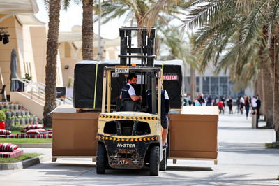 Paddock atmosphere - AlphaTauri freight carried through the paddock on a forklift