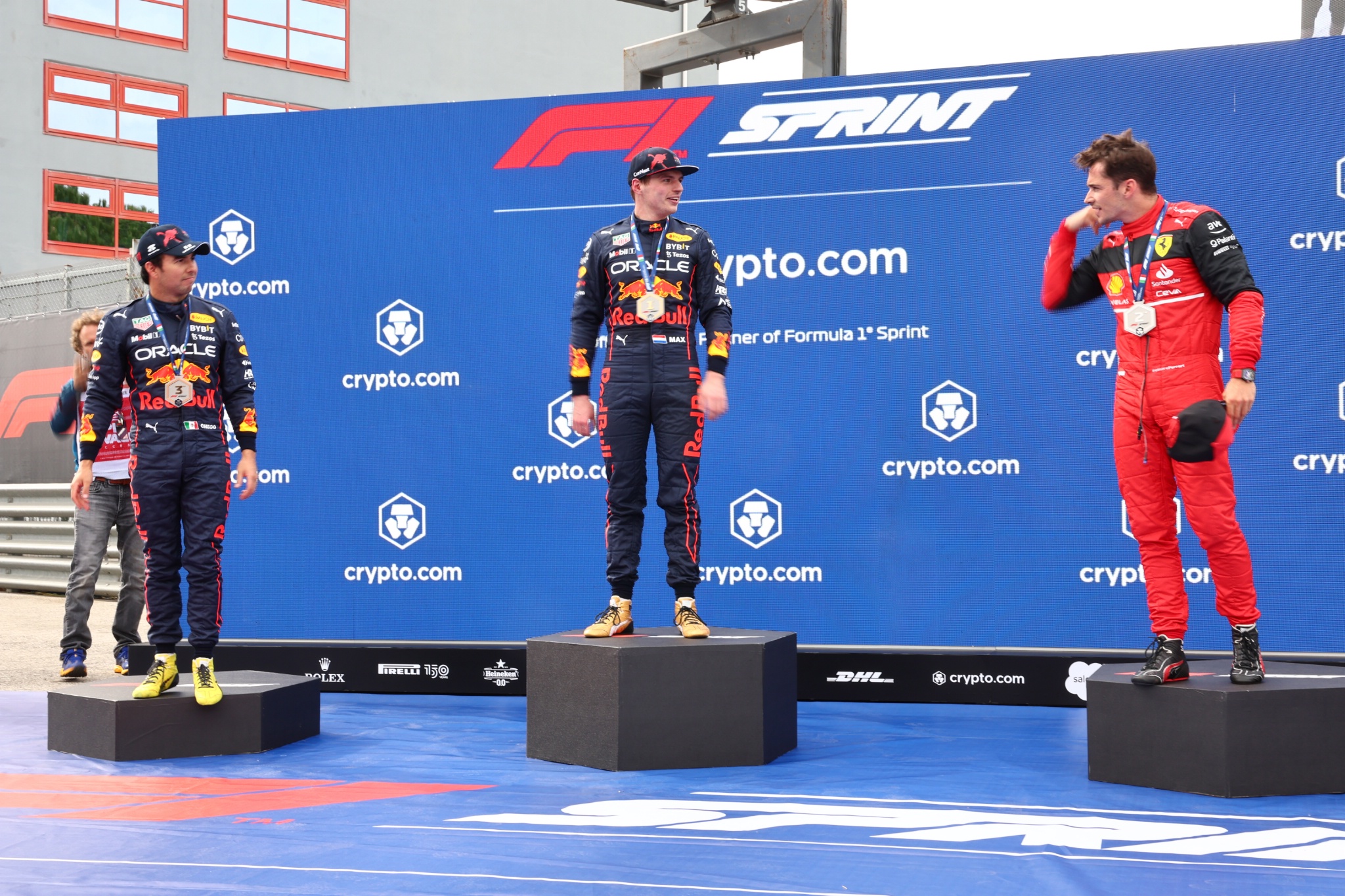 Sergio Perez (MEX) Red Bull Racing with Max Verstappen (NLD) Red Bull Racing and Charles Leclerc (MON) Ferrari. Formula 1
