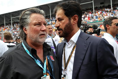 (L to R): Michael Andretti (USA) with Mohammed Bin Sulayem (UAE) FIA President on the grid. Formula 1 World Championship,