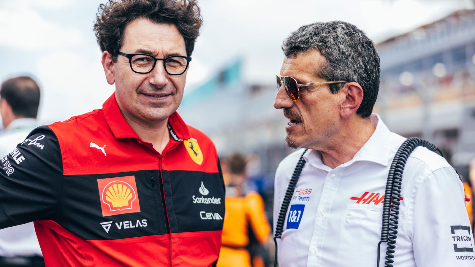 (L to R): Mattia Binotto (ITA) Ferrari Team Principal with Guenther Steiner (ITA) Haas F1 Team Prinicipal on the grid.
