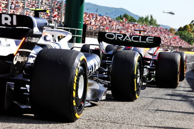 Max Verstappen (NLD) Red Bull Racing RB18 and Yuki Tsunoda (JPN) AlphaTauri AT03. Formula 1 World Championship, Rd 6,