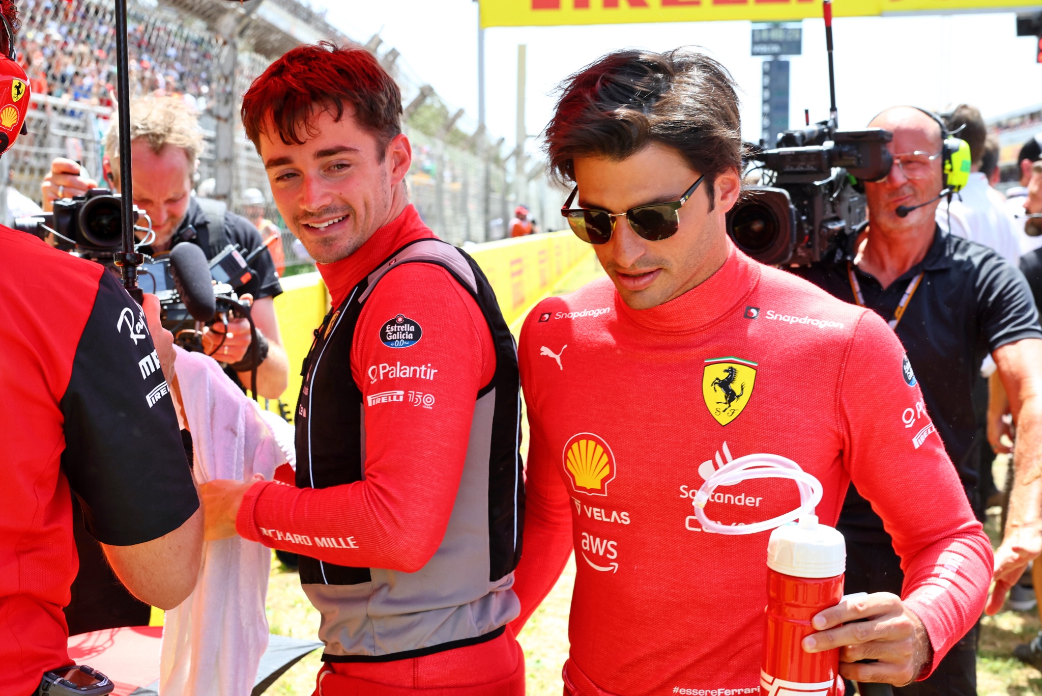 Carlos Sainz Jr (ESP) Ferrari with team mate Charles Leclerc (MON) Ferrari on the grid.. Formula 1 World Championship, Rd