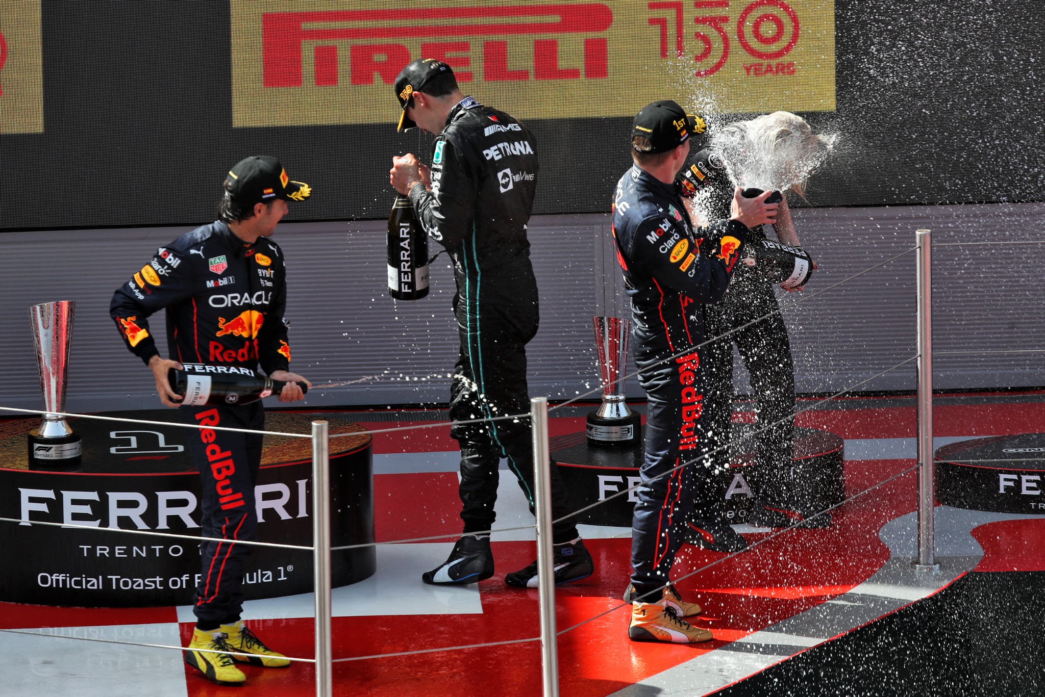 The podium (L to R): Sergio Perez (MEX) Red Bull Racing, second; Max Verstappen (NLD) Red Bull Racing, race winner; George