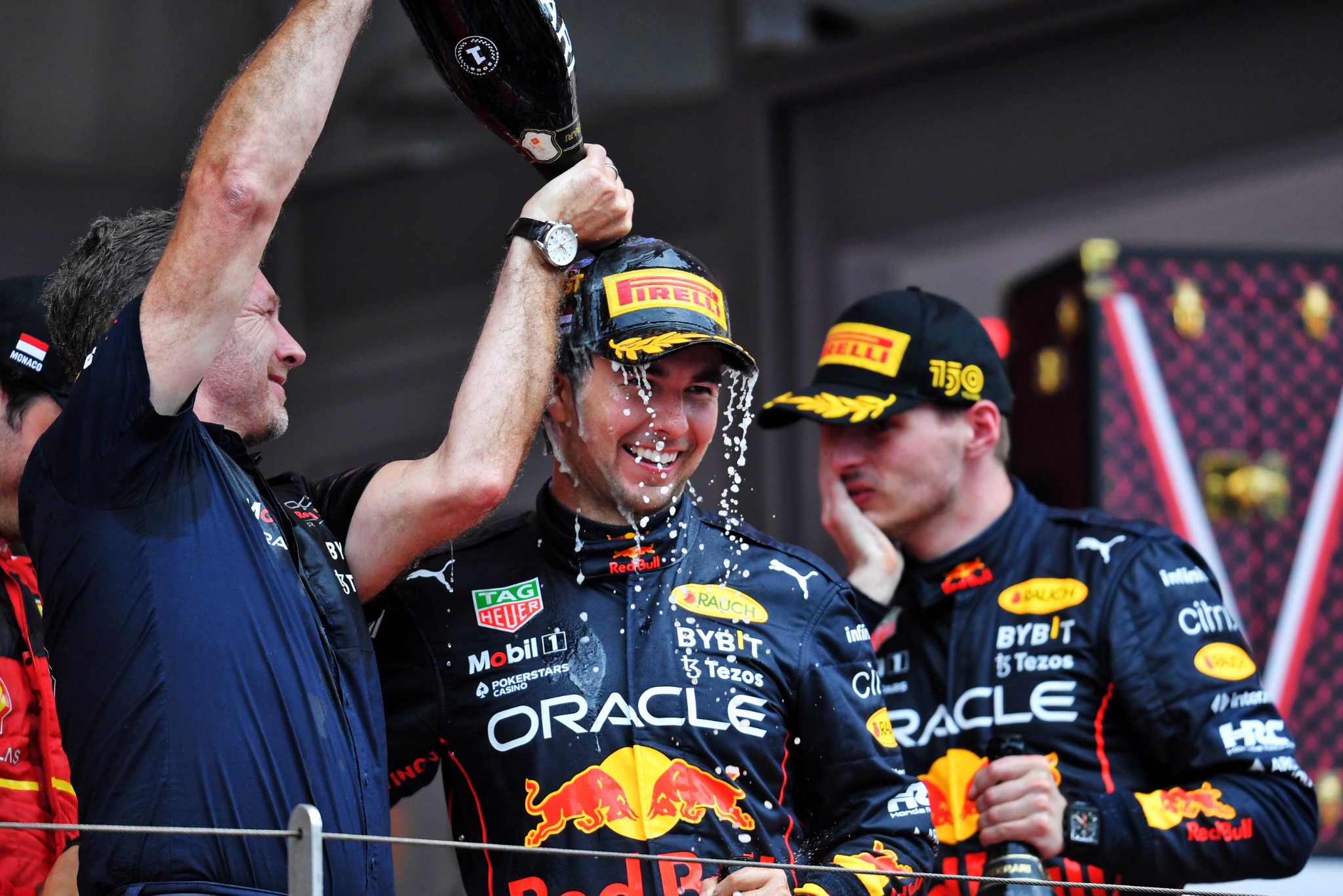 Race winner Sergio Perez (MEX) Red Bull Racing celebrates on the podium with Christian Horner (GBR) Red Bull Racing Team