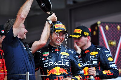 Race winner Sergio Perez (MEX) Red Bull Racing celebrates on the podium with Christian Horner (GBR) Red Bull Racing Team