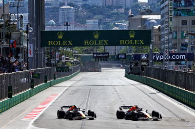 (L to R): Sergio Perez (MEX) Red Bull Racing RB18 is passed for the lead by team mate Max Verstappen (NLD) Red Bull Racing