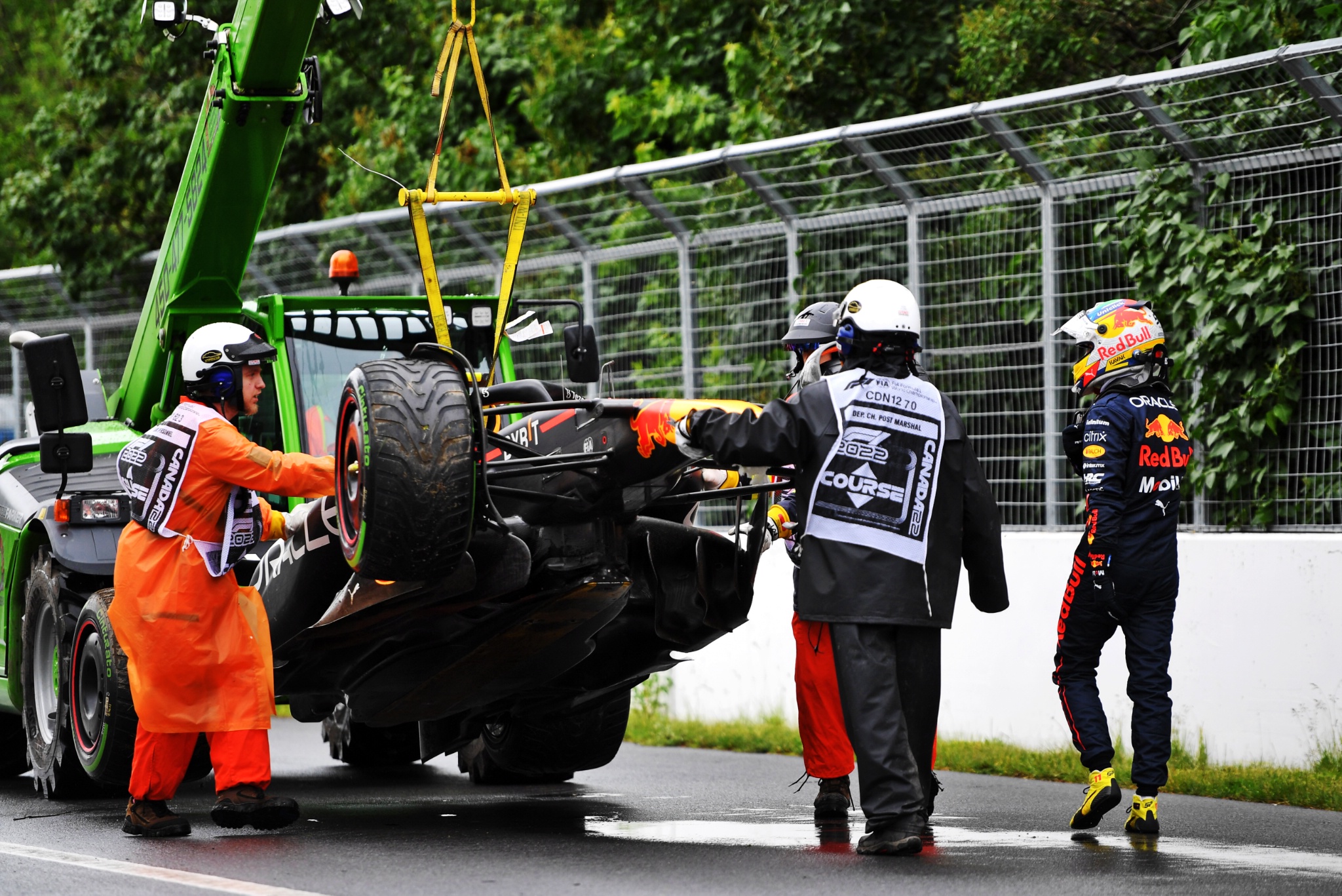 The Red Bull Racing RB18 of Sergio Perez (MEX) Red Bull Racing is recovered after he crashed during qualifying. Formula 1