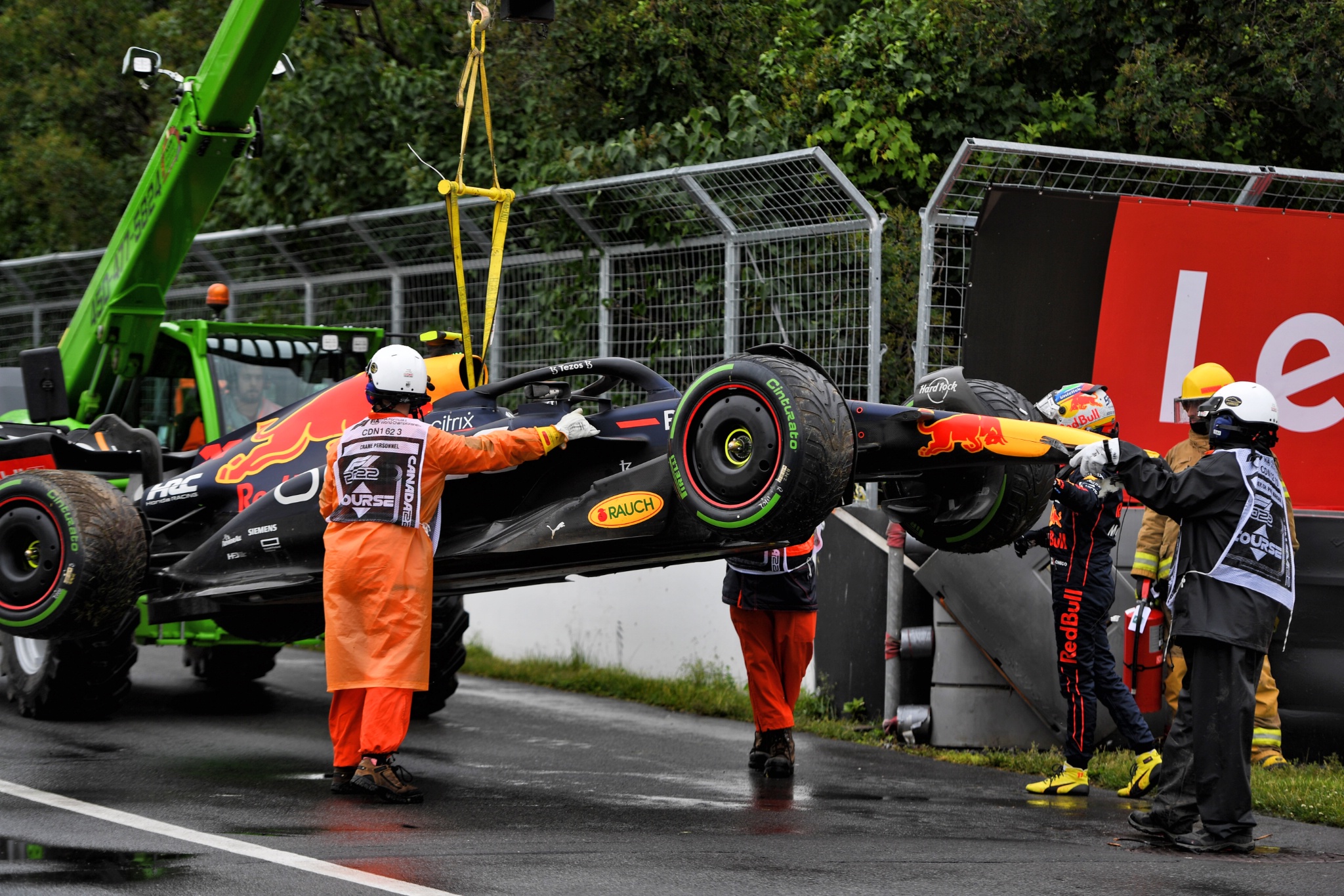 The Red Bull Racing RB18 of Sergio Perez (MEX) Red Bull Racing is recovered after he crashed during qualifying. Formula 1