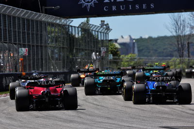 Charles Leclerc (MON) Ferrari F1-75 and Nicholas Latifi (CDN) Williams Racing FW44 at the start of the race. Formula 1