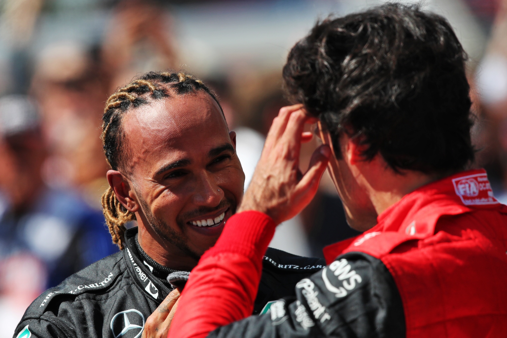 (L to R): Lewis Hamilton (GBR) Mercedes AMG F1 with Carlos Sainz Jr (ESP) Ferrari in parc ferme. Formula 1 World