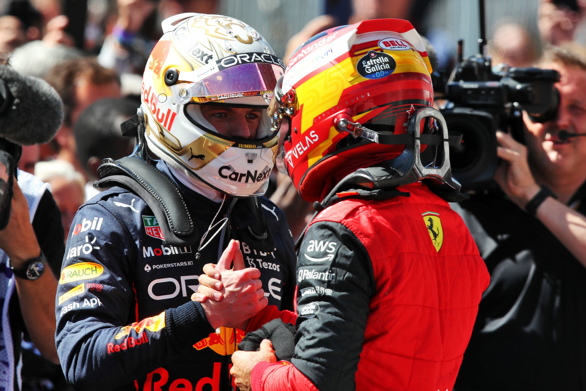 (L to R): race winner Max Verstappen (NLD) Red Bull Racing celebrates with second placed Carlos Sainz Jr (ESP) Ferrari in