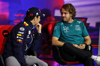 (L to R): Sergio Perez (MEX) Red Bull Racing and Sebastian Vettel (GER) Aston Martin F1 Team in the FIA Press Conference.