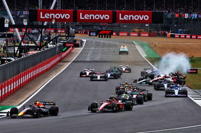 Guanyu Zhou (CHN) Alfa Romeo F1 Team C42 crashes at the start of the race. Formula 1 World Championship, Rd 10, British