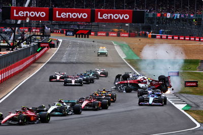 Guanyu Zhou (CHN) Alfa Romeo F1 Team C42 crashes at the start of the race. Formula 1 World Championship, Rd 10, British