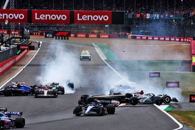 Guanyu Zhou (CHN) Alfa Romeo F1 Team C42 crashes at the start of the race. Formula 1 World Championship, Rd 10, British