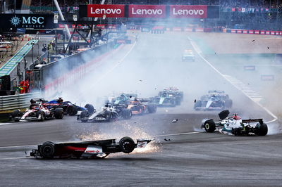 Guanyu Zhou (CHN) Alfa Romeo F1 Team C42 crashes at the start of the race. Formula 1 World Championship, Rd 10, British