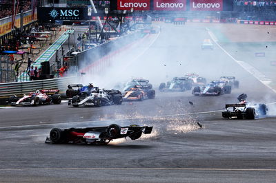 Guanyu Zhou (CHN) Alfa Romeo F1 Team C42 crashes at the start of the race. Formula 1 World Championship, Rd 10, British