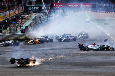 Guanyu Zhou (CHN) Alfa Romeo F1 Team C42 crashes at the start of the race. Formula 1 World Championship, Rd 10, British