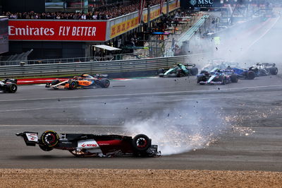 Guanyu Zhou (CHN) Alfa Romeo F1 Team C42 crashes at the start of the race. Formula 1 World Championship, Rd 10, British