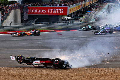 Guanyu Zhou (CHN) Alfa Romeo F1 Team C42 crashes at the start of the race. Formula 1 World Championship, Rd 10, British